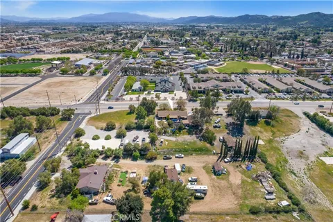 an aerial view of residential house and swimming pool