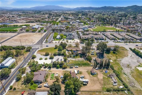 an aerial view of residential house and swimming pool