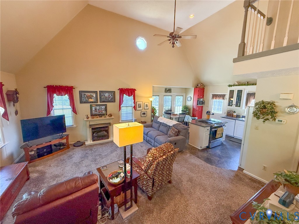 45 Gallion Town Road Victoria, VA 23974 - Photo 9 of 41 a living room with furniture a rug and gym equipment
