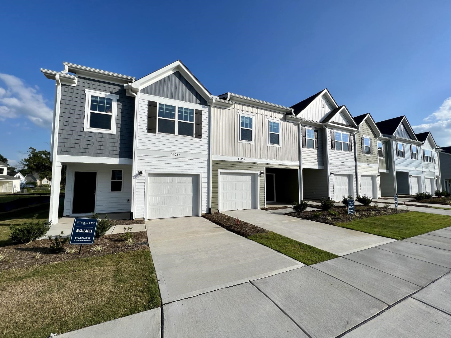 3403 A Walker Wilson, NC 27893 - Photo 1 of 23 a front view of a house with yard and parking