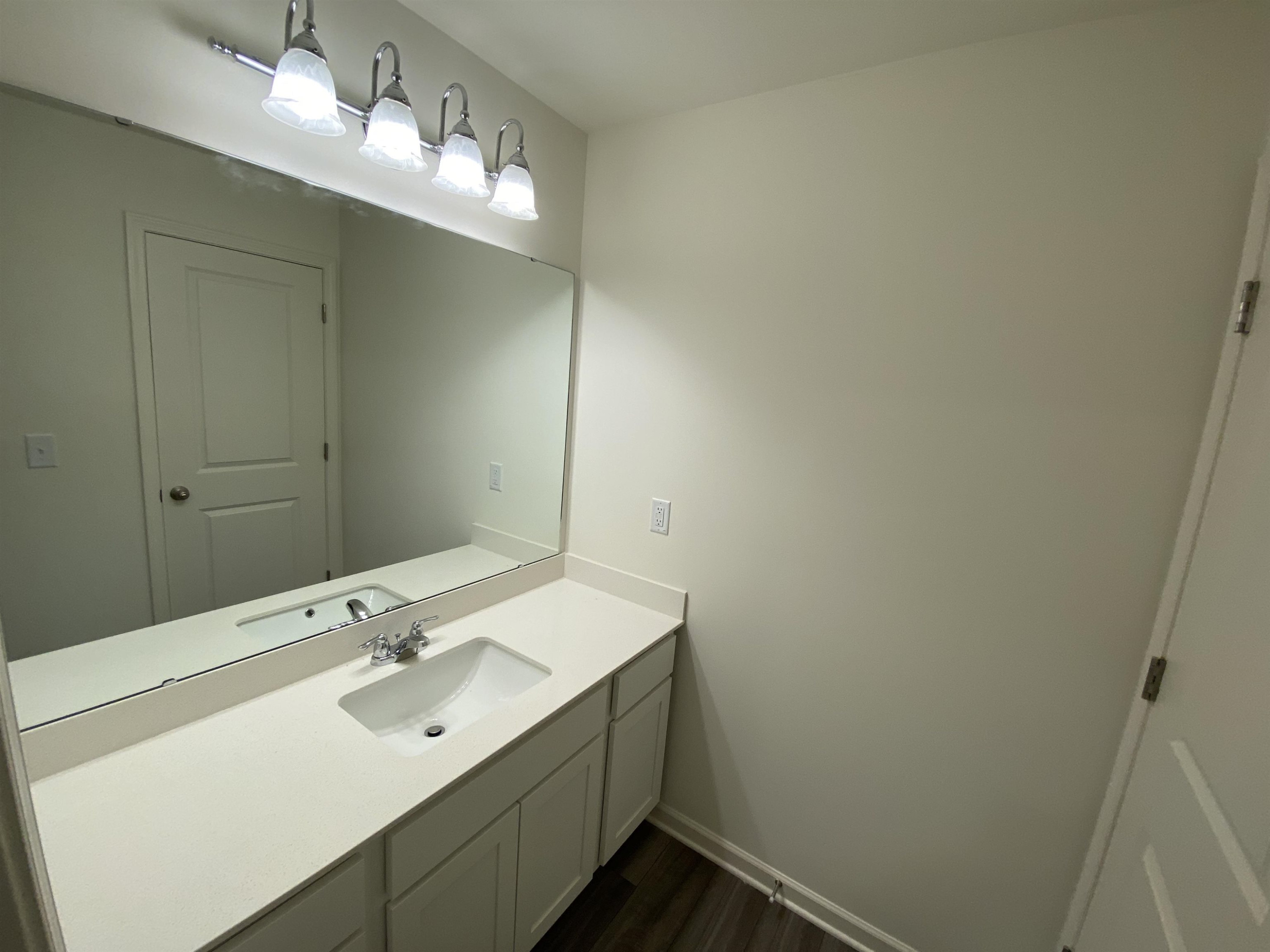 3403 A Walker Wilson, NC 27893 - Photo 14 of 23 a bathroom with a sink and a mirror
