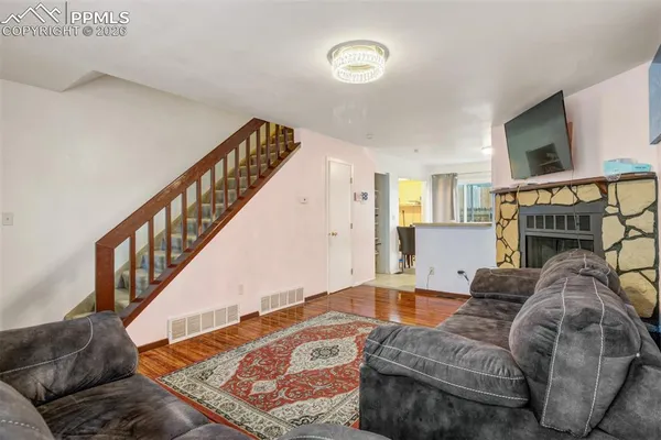 a living room with furniture and a fireplace