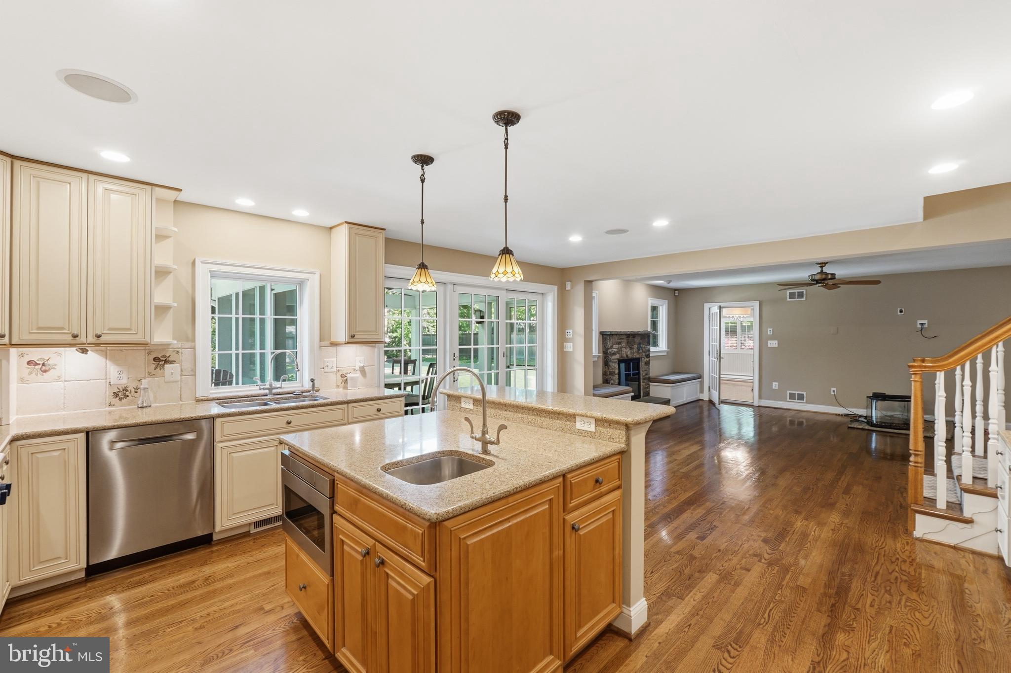 9904 Hall Road Potomac, MD 20854 - Photo 3 of 37 a kitchen with stainless steel appliances granite countertop a sink a stove and a wooden floors