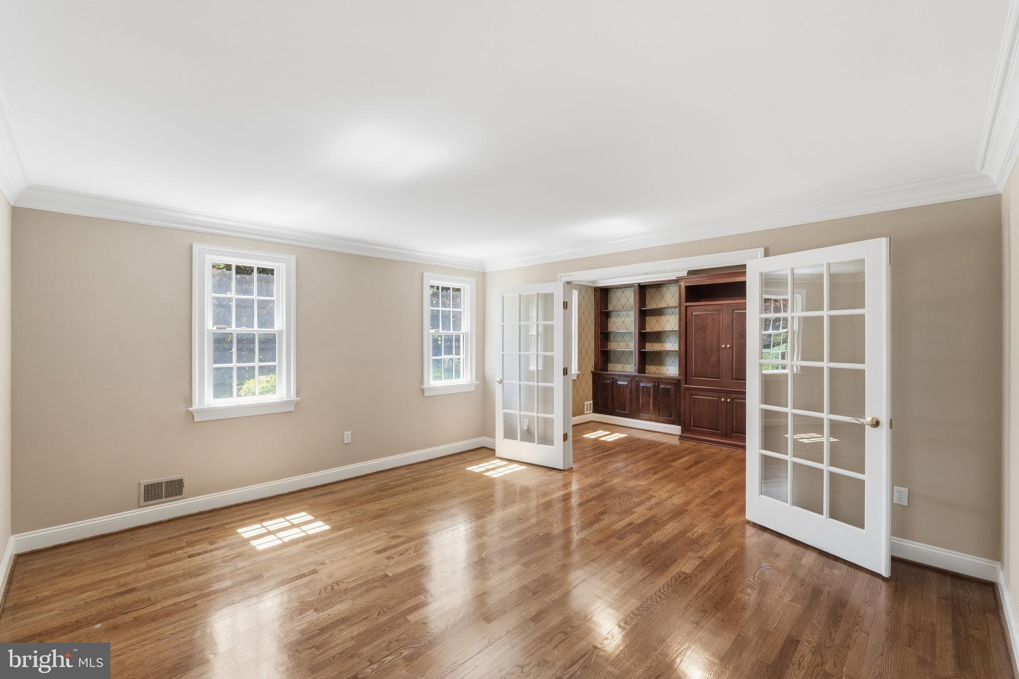 9904 Hall Road Potomac, MD 20854 - Photo 7 of 37 a view of an empty room with wooden floor and a window