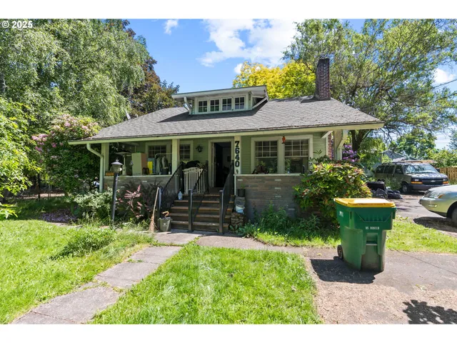 a car parked in front of white house