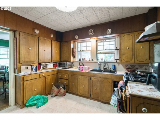 an aerial view of houses with yard