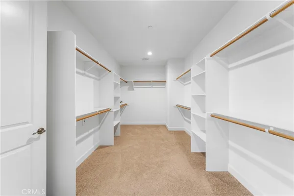 a view of entryway with white walls and stairs
