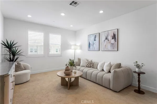 a living room with furniture and window