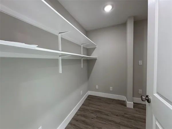 a view of an empty walk in closet