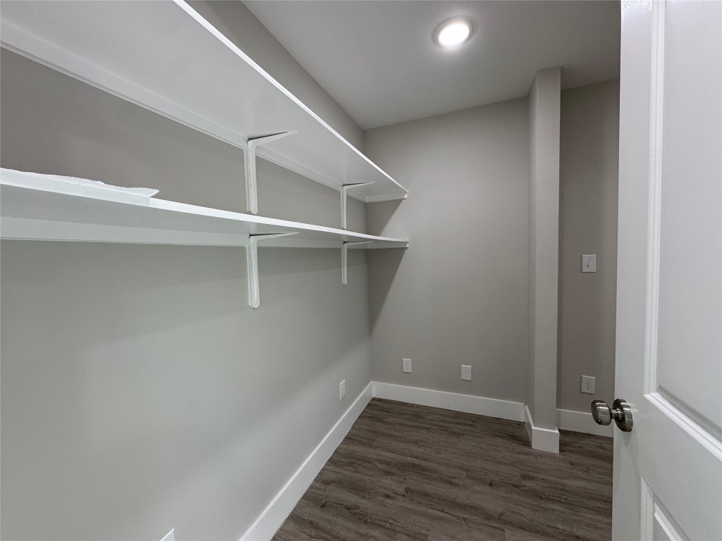 813 Central Avenue Elgin, TX 78621 - Photo 11 of 26 a view of an empty walk in closet
