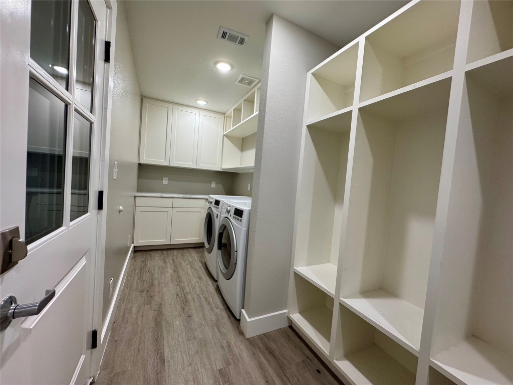 813 Central Avenue Elgin, TX 78621 - Photo 12 of 26 a view of a hallway with washer and dryer