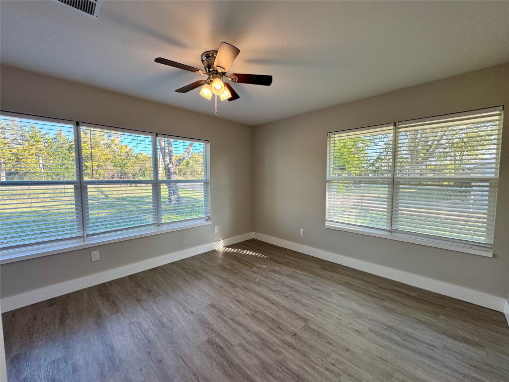813 Central Avenue Elgin, TX 78621 - Photo 23 of 26 a view of an empty room with wooden floor and a window