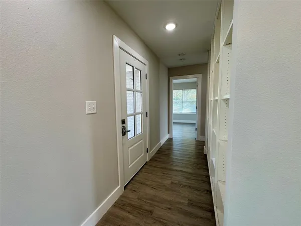 a view of kitchen with cabinets and wooden floor
