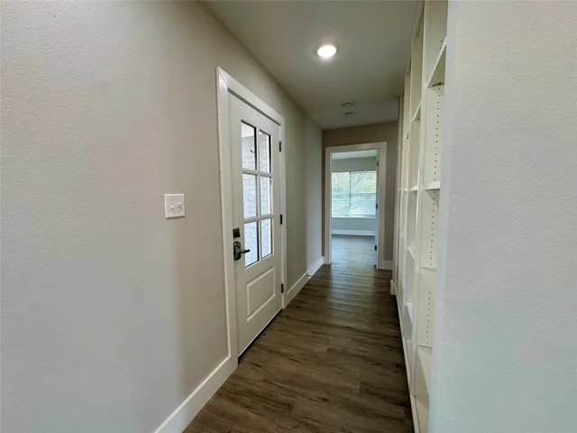 a view of kitchen with cabinets and wooden floor