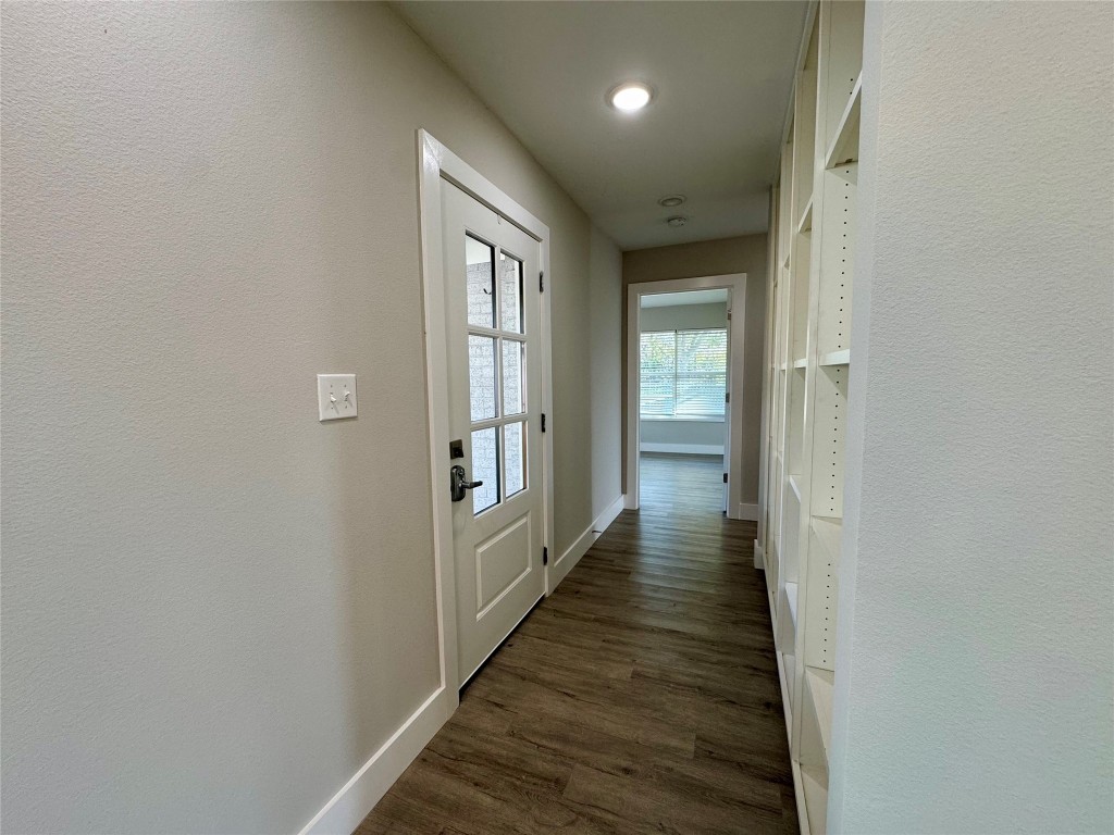 813 Central Avenue Elgin, TX 78621 - Photo 5 of 26 a view of a hallway with wooden floor and staircase