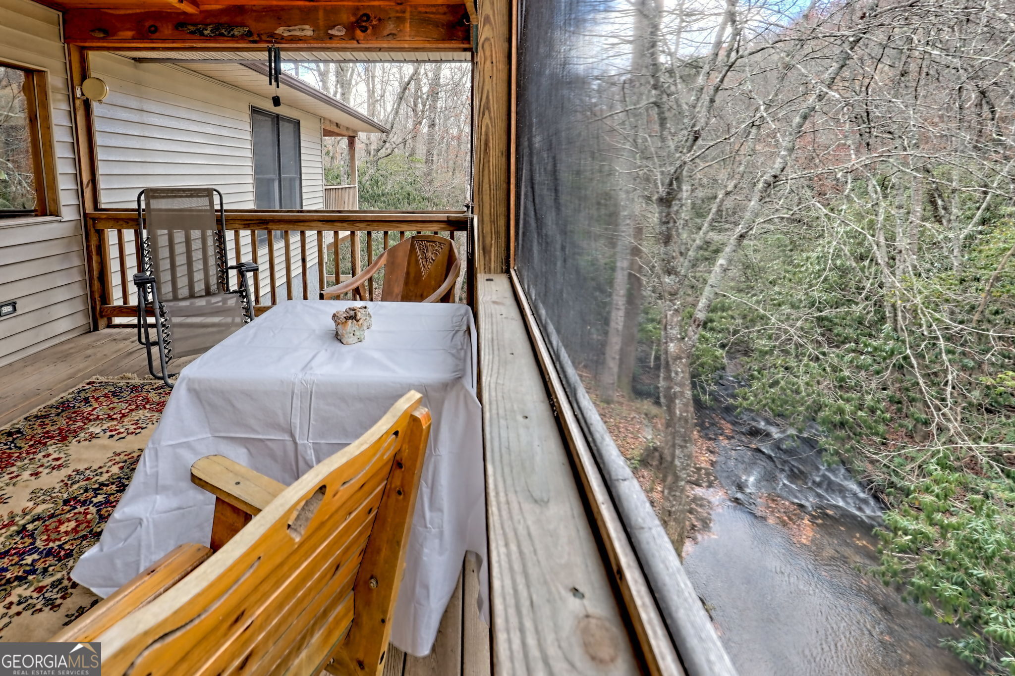 7829 Dillard Road Scaly Mountain, NC 28775 - Photo 24 of 97 a balcony with trees in front of it