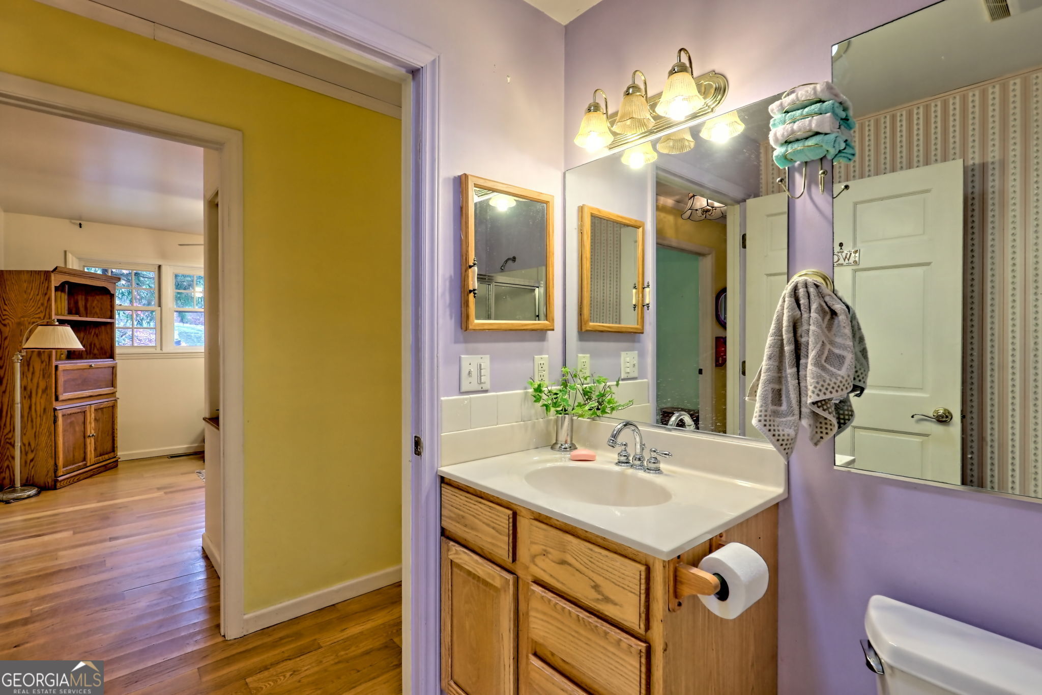 7829 Dillard Road Scaly Mountain, NC 28775 - Photo 36 of 97 a bathroom with a sink vanity granite and a mirror