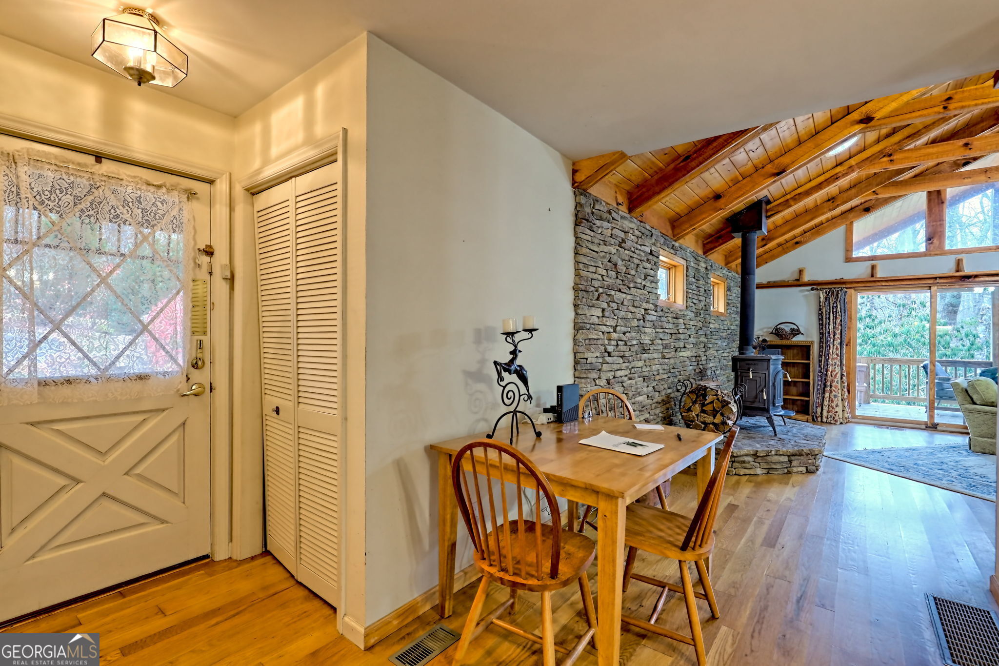 7829 Dillard Road Scaly Mountain, NC 28775 - Photo 39 of 97 a view of a dining room with furniture and wooden floor