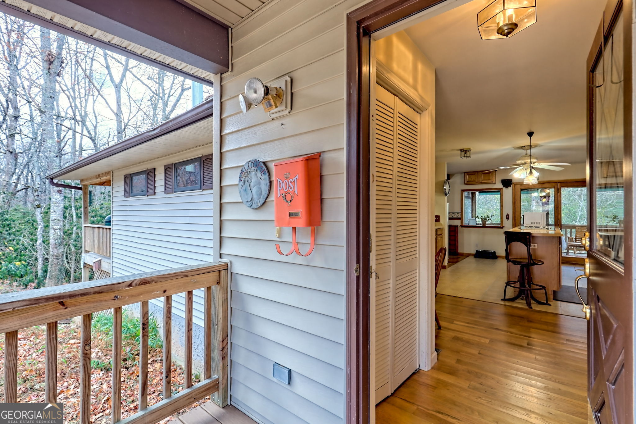7829 Dillard Road Scaly Mountain, NC 28775 - Photo 48 of 97 a view of a balcony with furniture and wooden floor