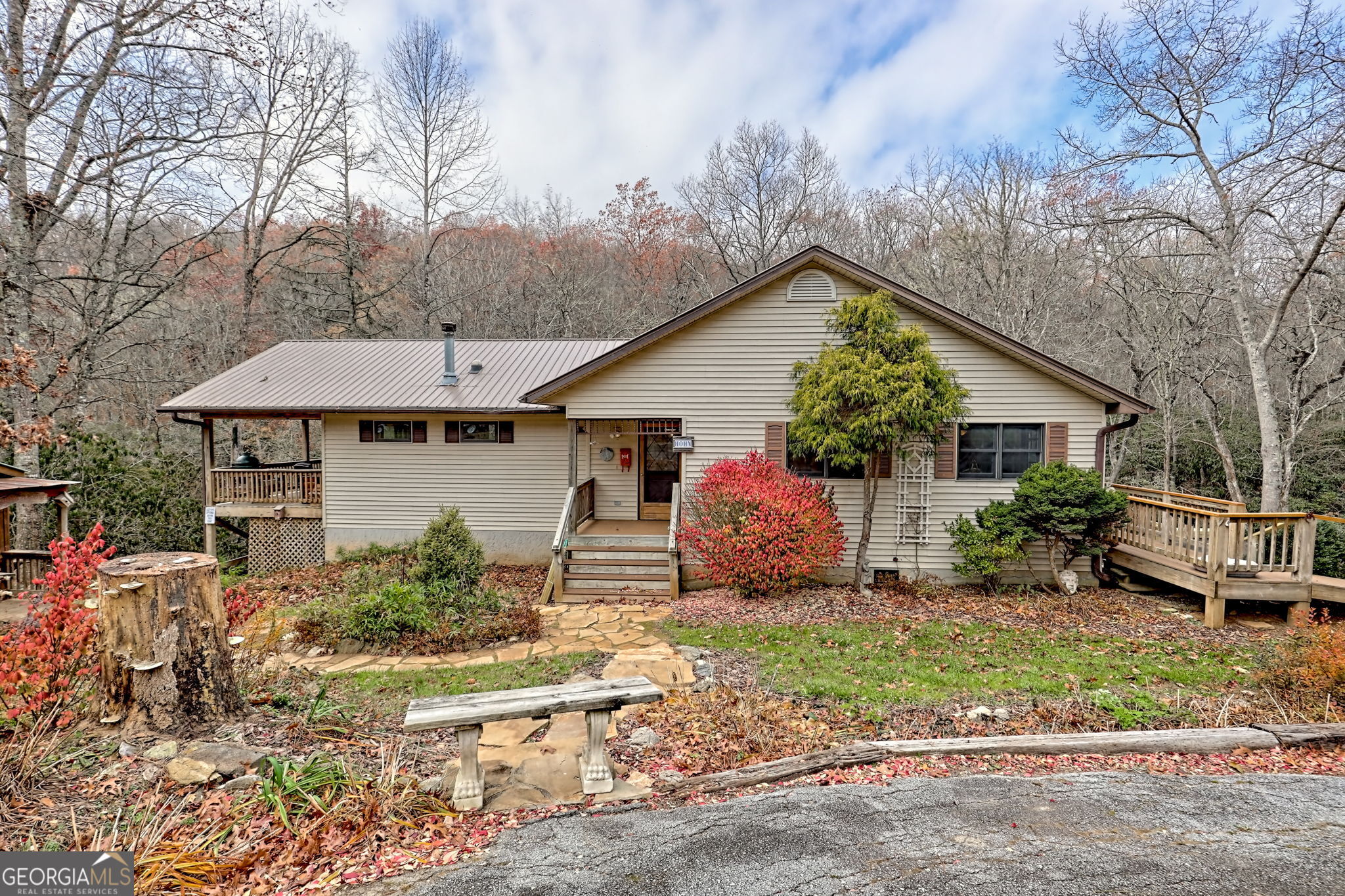 7829 Dillard Road Scaly Mountain, NC 28775 - Photo 61 of 97 a front view of a house with garden