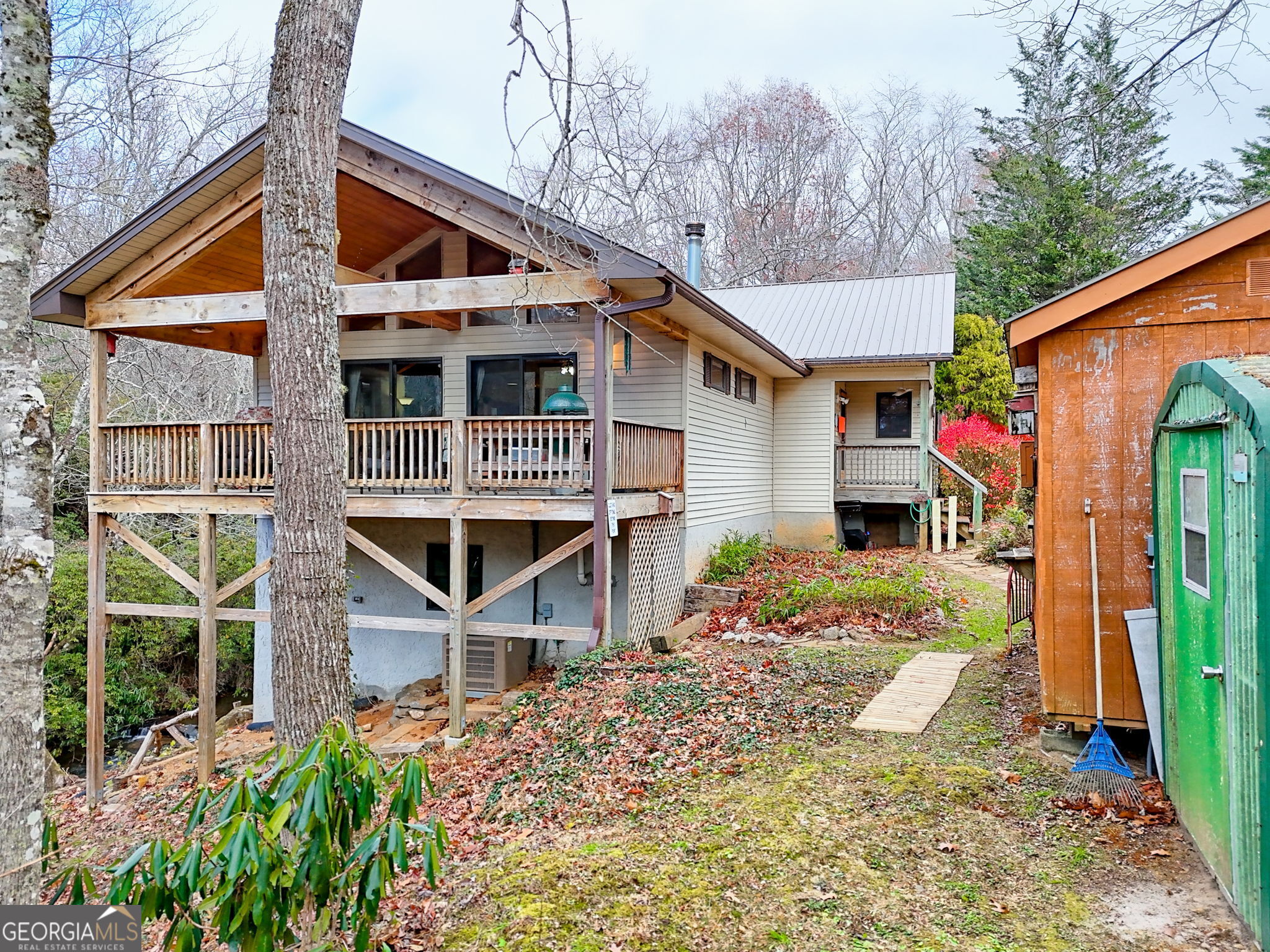 7829 Dillard Road Scaly Mountain, NC 28775 - Photo 67 of 97 a front view of a house with a yard