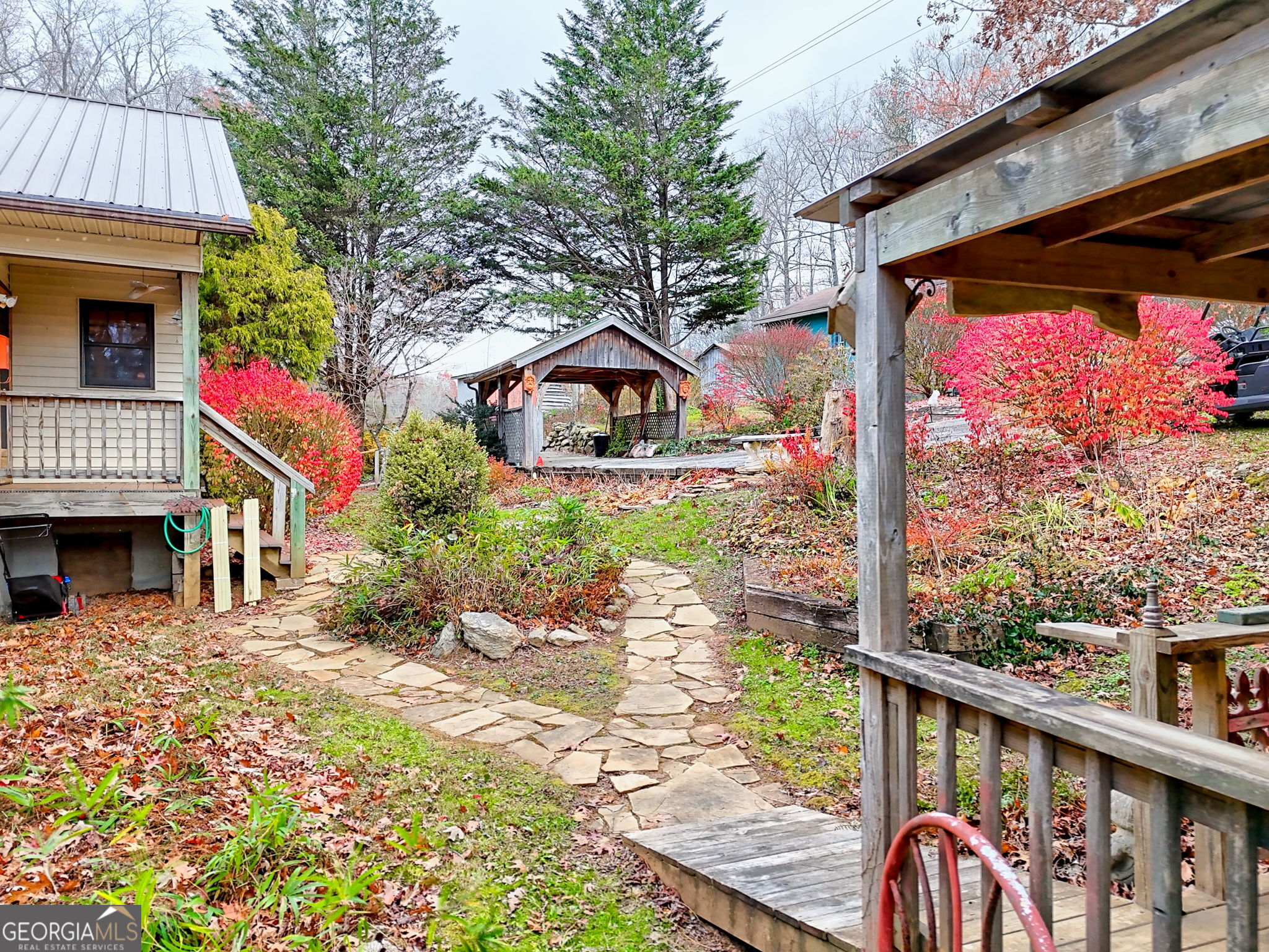 7829 Dillard Road Scaly Mountain, NC 28775 - Photo 69 of 97 a front view of a house with garden