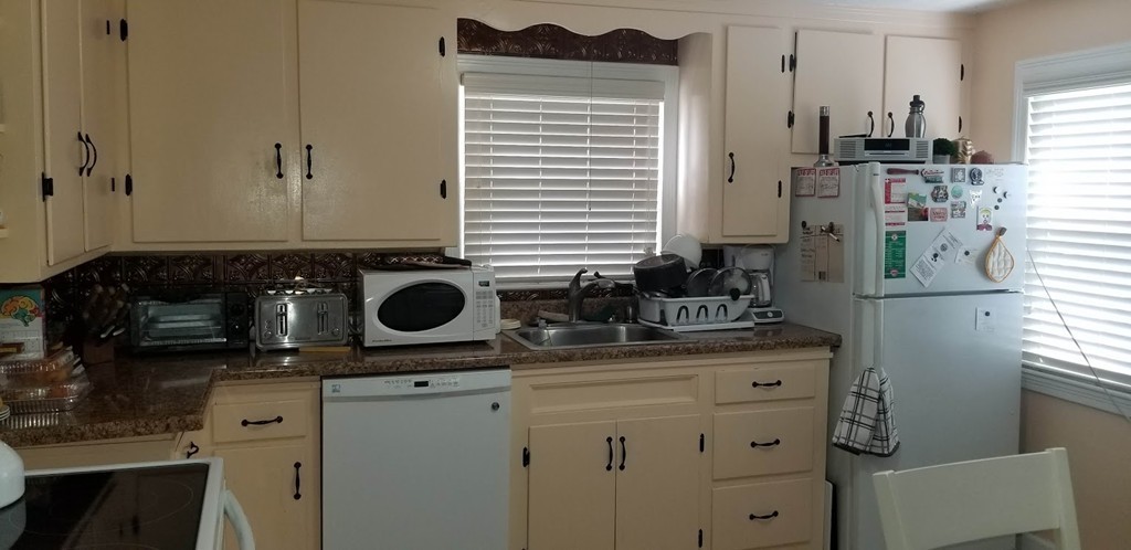 43 Sargon Street Springfield, MA 01104 - Photo 15 of 25 a kitchen with stainless steel appliances granite countertop a sink stove and refrigerator