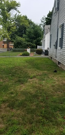43 Sargon Street Springfield, MA 01104 - Photo 3 of 25 a backyard of a house with lots of green space