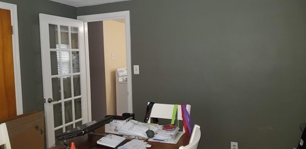 43 Sargon Street Springfield, MA 01104 - Photo 4 of 25 a workspace with furniture and mirror