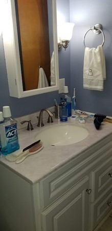 43 Sargon Street Springfield, MA 01104 - Photo 8 of 25 a bathroom with a sink and a mirror