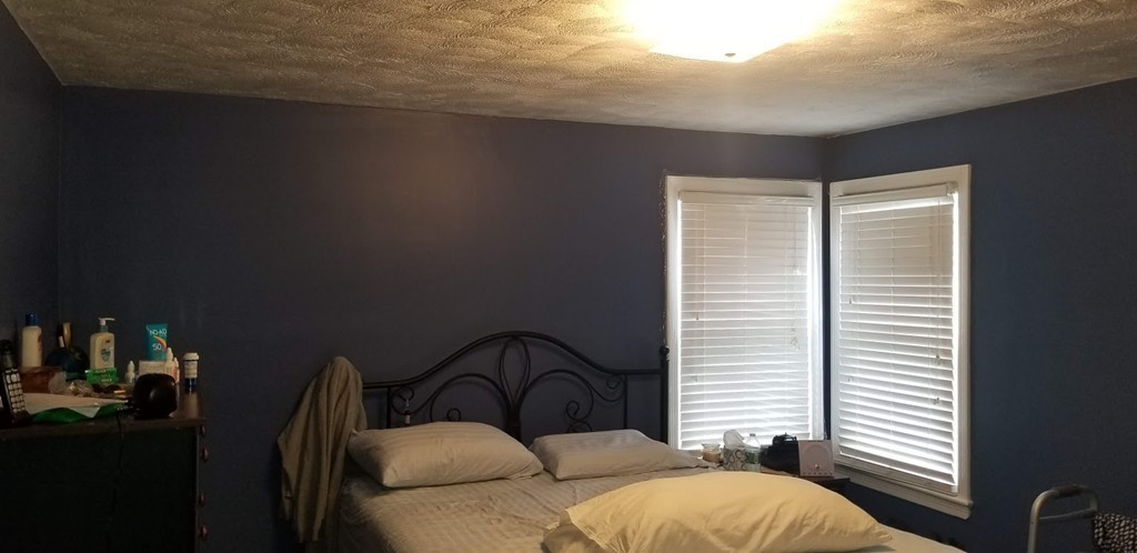 43 Sargon Street Springfield, MA 01104 - Photo 9 of 25 a bedroom with a bed and a large window