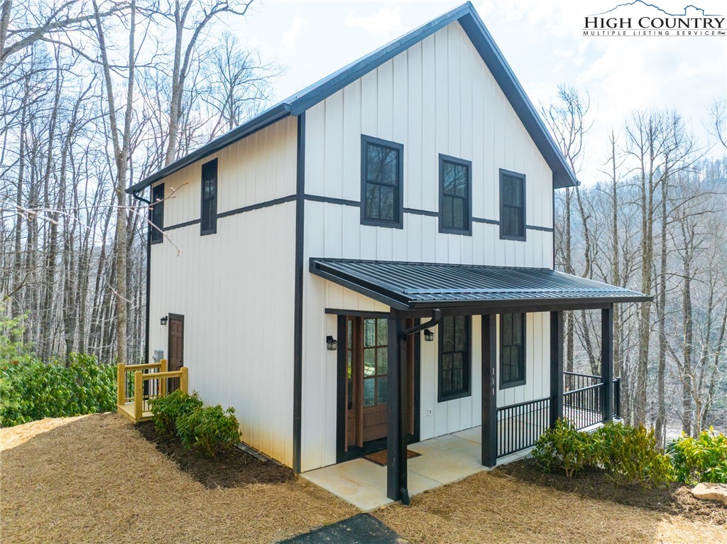 131 Bryce Way Boone, NC 28607 - Photo 37 of 38 a front view of a house with garden