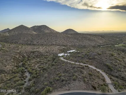 a dining room with a table and chairs