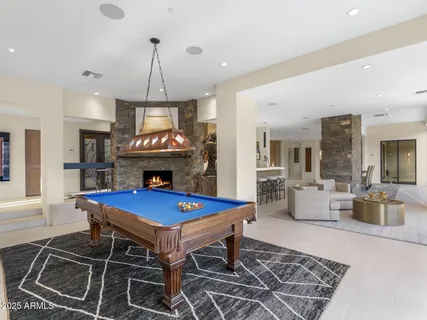 a bedroom with a large bed and a couch