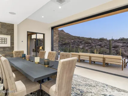 a spacious bedroom with a bed and a large window