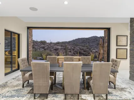 a bathroom with a double vanity sink and a large mirror