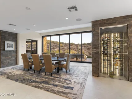 a bathroom with a granite countertop sink a mirror and shower