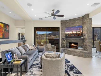 a view of a terrace with furniture and city view