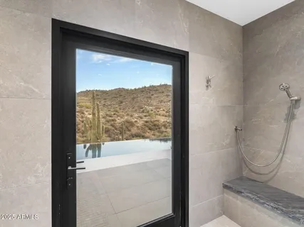a bathroom with a shower and a sink