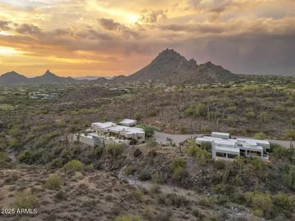 a balcony with table and chairs