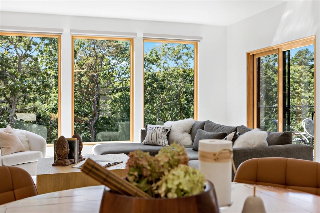 1924R State Road Plymouth, MA 02360 - Photo 12 of 41 a living room with patio furniture and a large window