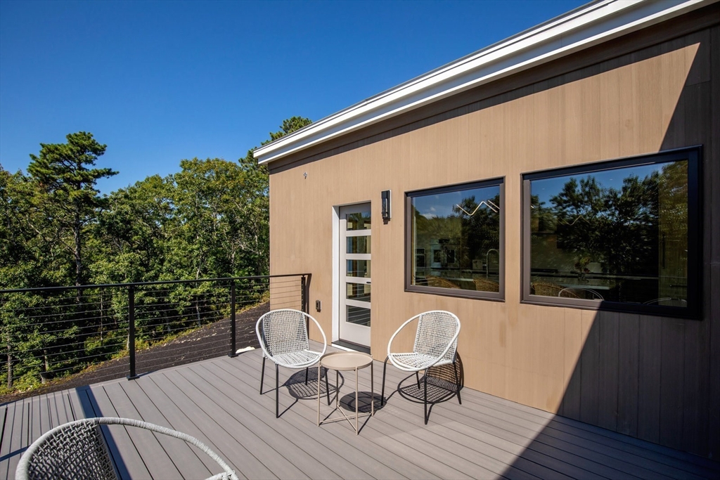 1924R State Road Plymouth, MA 02360 - Photo 21 of 41 a view of a two chairs in the balcony