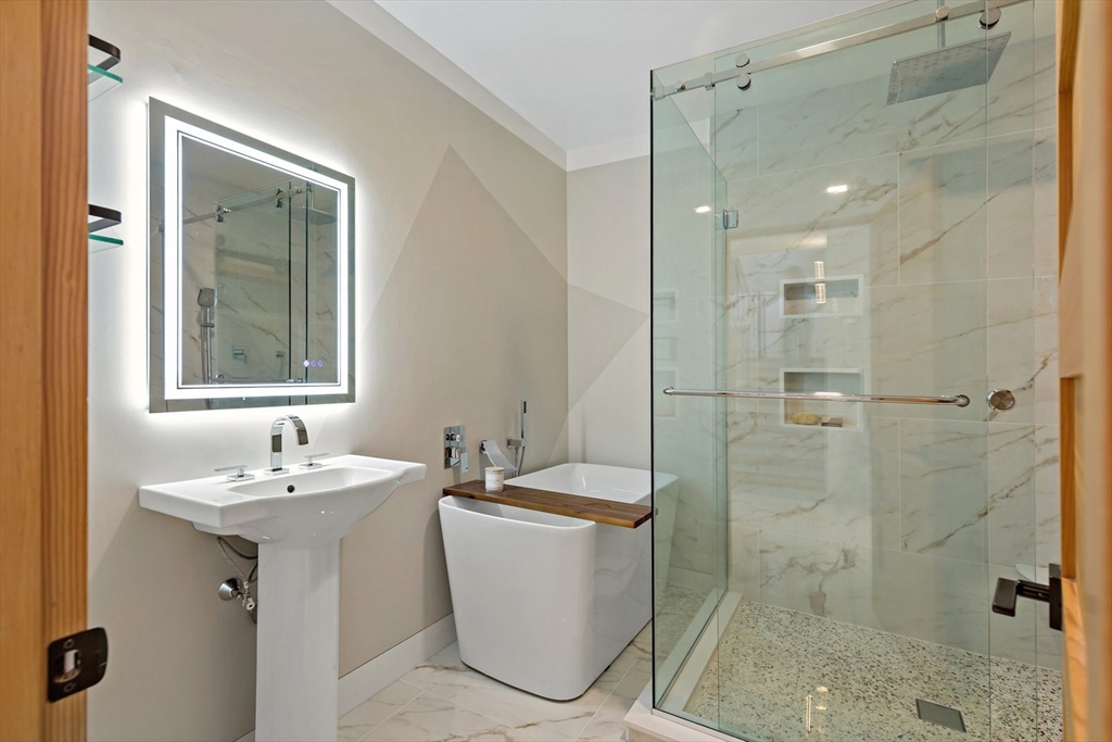 1924R State Road Plymouth, MA 02360 - Photo 24 of 41 a bathroom with a sink a toilet and shower