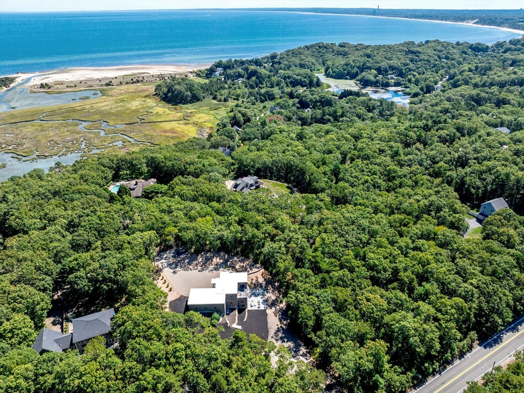 1924R State Road Plymouth, MA 02360 - Photo 40 of 41 an aerial view of residential houses with outdoor space and trees all around