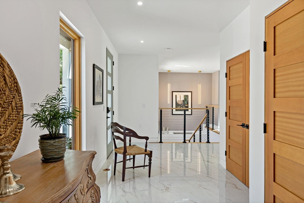 1924R State Road Plymouth, MA 02360 - Photo 7 of 41 a view of a livingroom with furniture and a potted plant