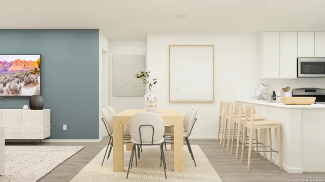 a dining room with furniture and wooden floor