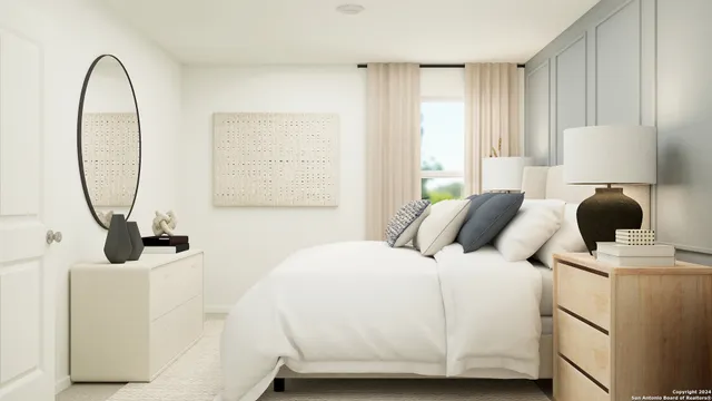 a bedroom with a bed and a mirror