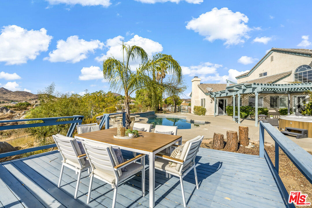 38675 Green Meadow Road Temecula, CA 92592 - Photo 23 of 74 a view of a swimming pool with outdoor seating and city view