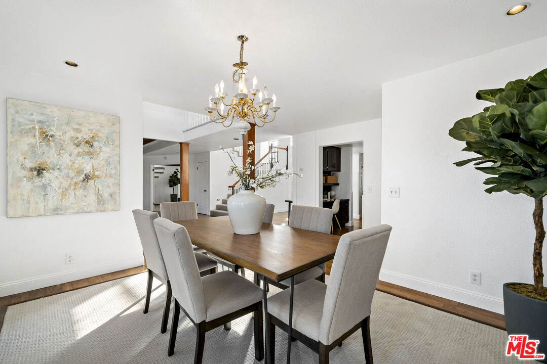 38675 Green Meadow Road Temecula, CA 92592 - Photo 40 of 74 a view of a dining room with furniture and wooden floor
