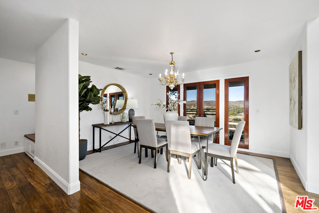 38675 Green Meadow Road Temecula, CA 92592 - Photo 41 of 74 a view of a dining room with furniture window and wooden floor